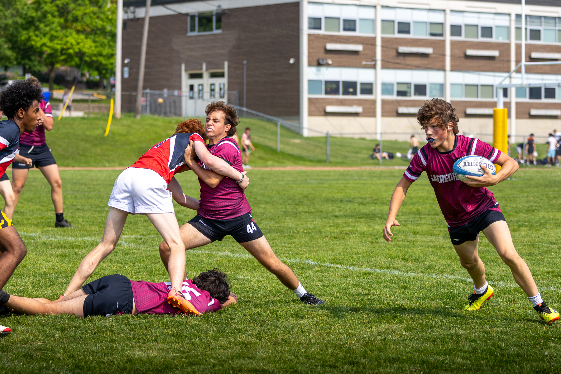 Soccer team huddled together mid-game during an indoor tournament in Ontario
