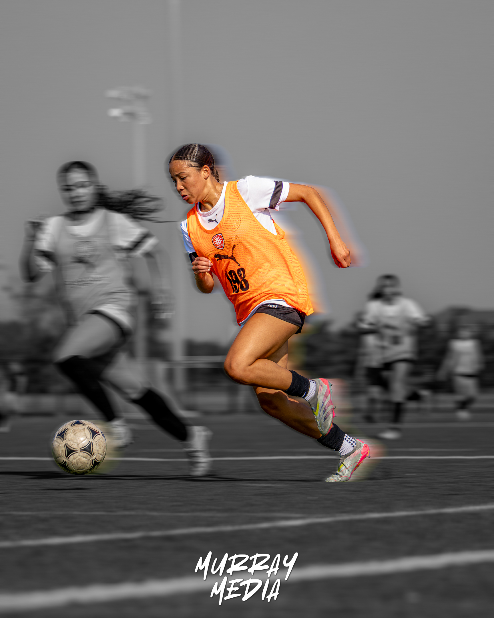 Soccer players competing for possession during a youth tournament in York Region
